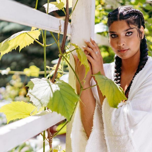 A person looking calm and relaxed in a natural setting.